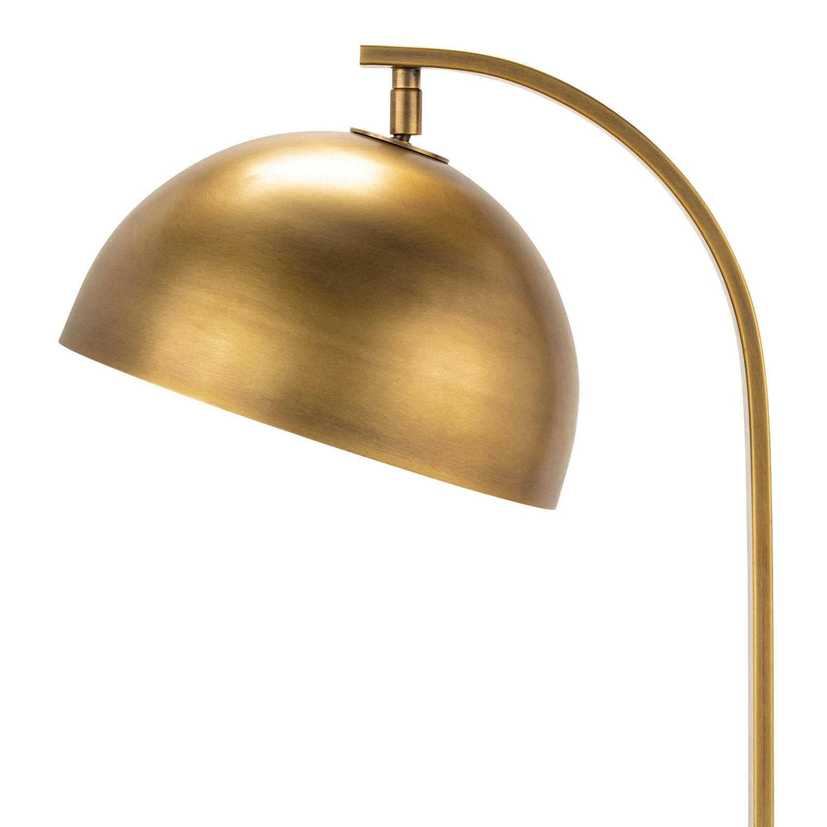 Otto desk lamp with a natural brass finish, adjustable metal dome shade, and curved neck.