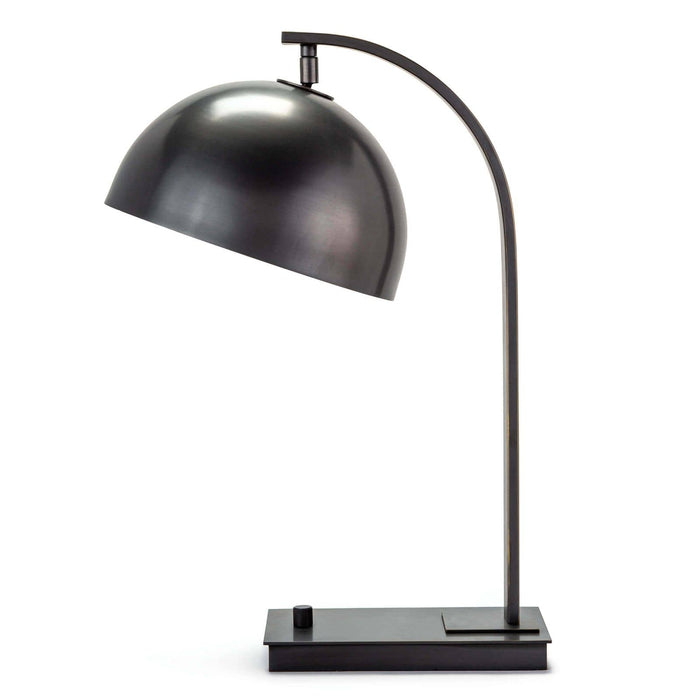Otto desk lamp in oil rubbed bronze with a curved neck and adjustable metal dome shade.