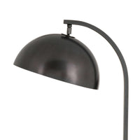 Close-up of the Otto floor lamp's dark metal swiveling dome shade and arching neck.