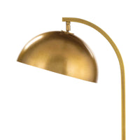 Modern Otto floor lamp with a sleek, arching brass neck and a swiveling, dome-shaped metal shade.
