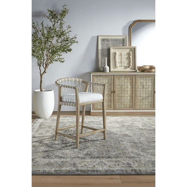 Pacific White Rope Counter Stool with mahogany frame and white woven rope back, on a patterned rug.