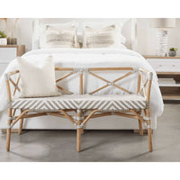 Coastal Palisades natural rattan bench with white and beige chevron woven seat and X-back design.