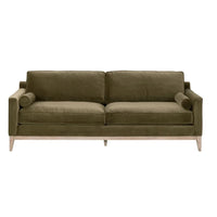 Parker 86" Post Modern Sofa with olive green velvet upholstery, natural gray oak frame, and two bolster pillows.