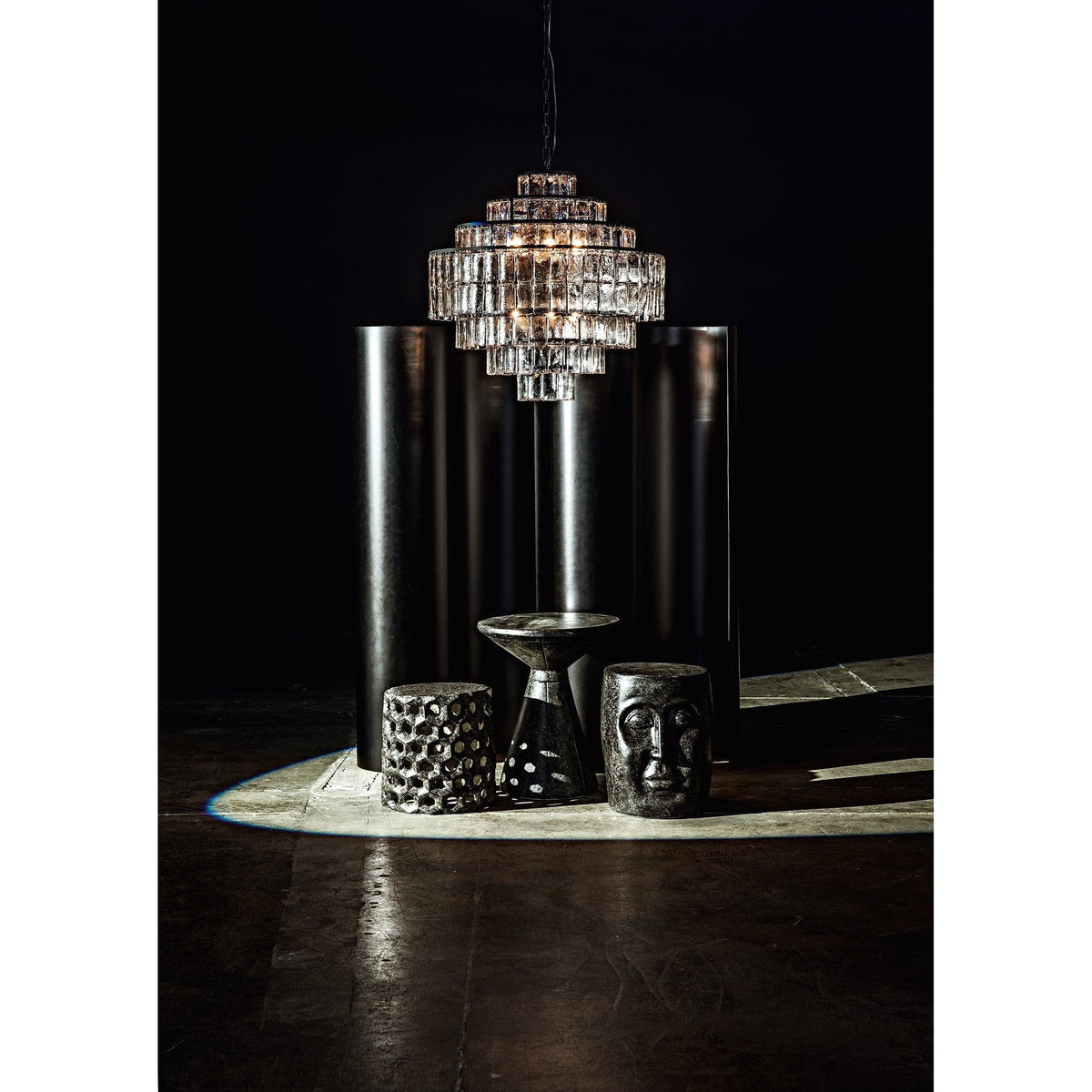 Black fiber cement pedestal side table with natural textured finish, 24"H.