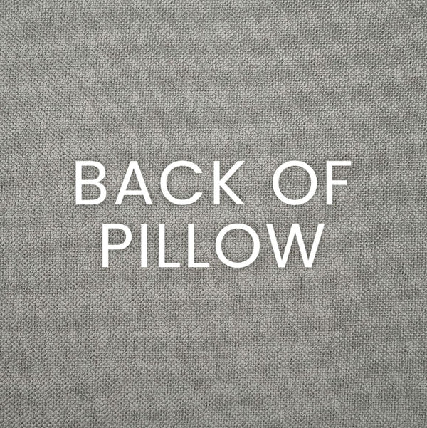 Text "BACK OF PILLOW" on a textured gray polyester fabric.