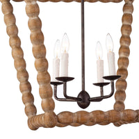 Natural wood Perennial Lantern with rustic chic finish, faux drip wax candle sleeves, and dark metal accents.
