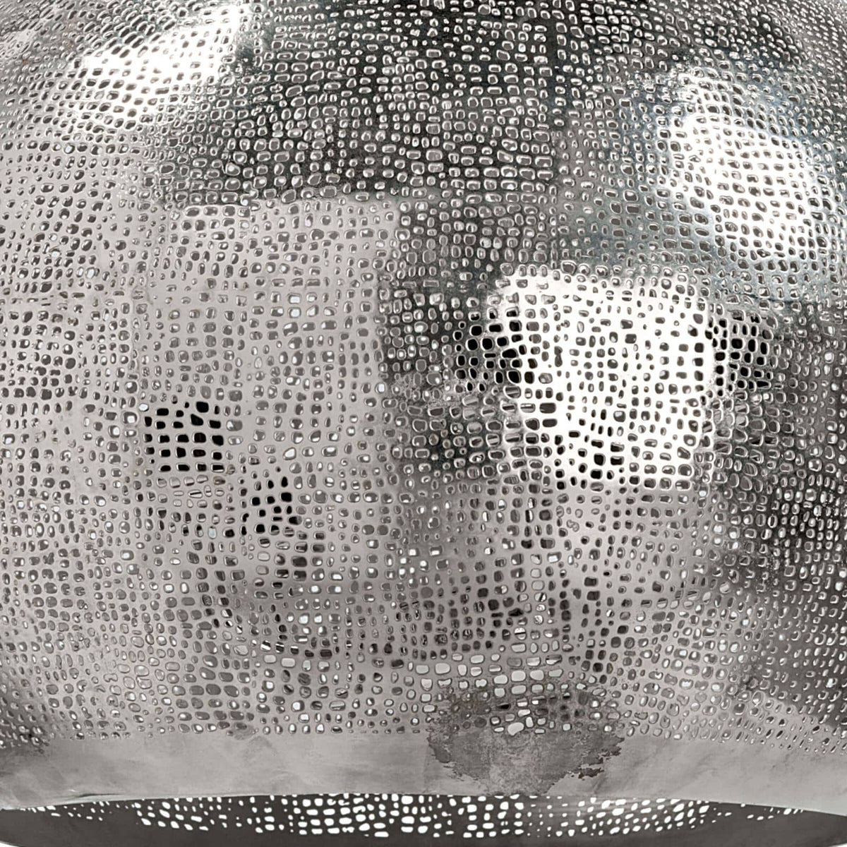 Polished nickel pierced metal sphere pendant, 18" wide, with organic perforated design.