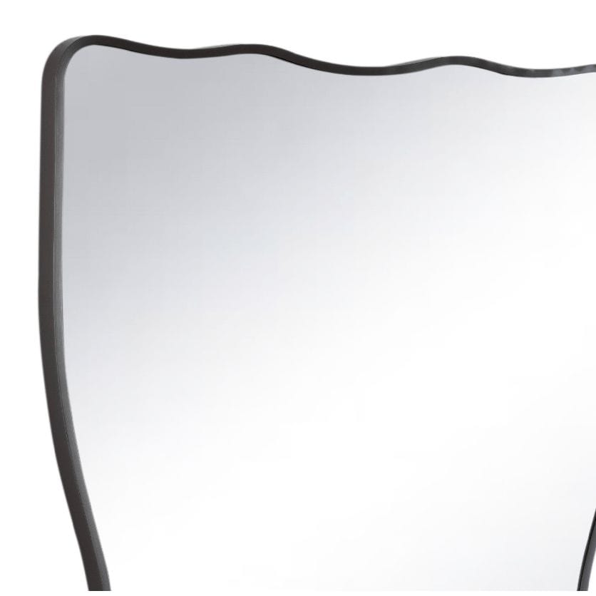Piero Metal Mirror with a wavy, ribbon-shaped steel-plated frame, reflecting light.