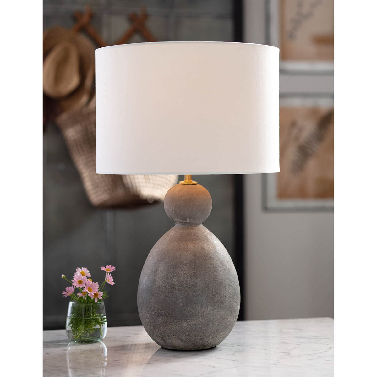 Playa Ceramic Table Lamp with a large, textured gray ceramic body and a crisp white linen drum shade.