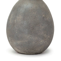 Close-up of the Playa Ceramic Table Lamp base, showing its large, egg-shaped body with an organic, earthen-toned glaze.