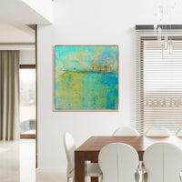 Abstract giclee canvas painting by Maeve Harris, featuring turquoise and yellow hues with a textured gel finish, displayed in a modern dining room.
