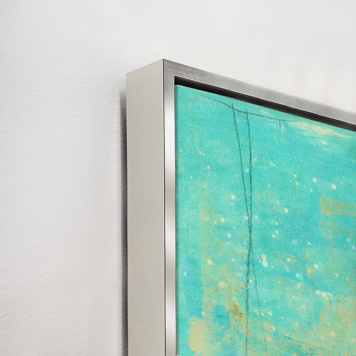 Close-up of a turquoise and yellow abstract giclee canvas painting with a textured gel finish and silver frame.