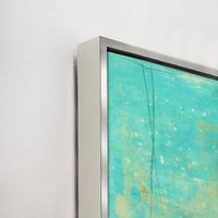 Close-up of a turquoise and yellow abstract giclee canvas painting with a textured gel finish and silver frame.