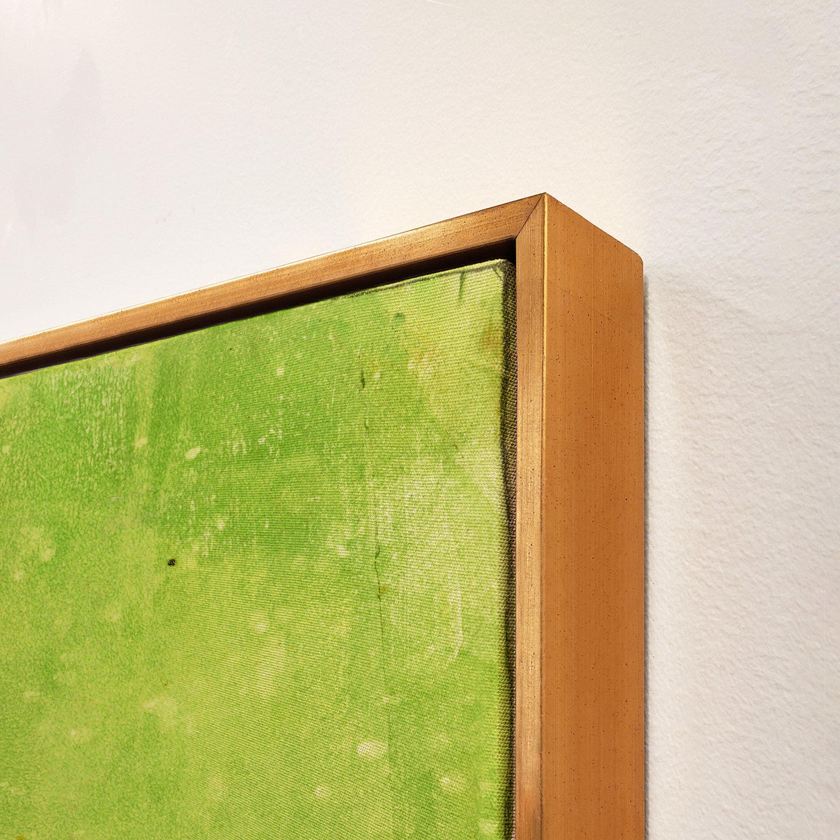 Close-up of a green giclee canvas painting with knife gel finish in a gold floating frame.