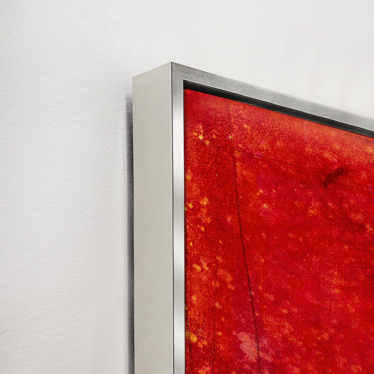 Abstract red and yellow giclee canvas painting with a knife gel finish in a sleek silver frame.