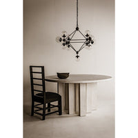 Pluto Celestial black chandelier with multiple round glass bulbs orbiting a diamond-shaped metal structure.