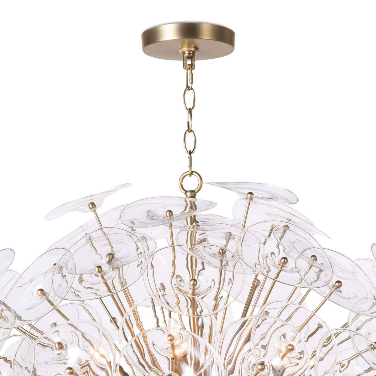 Poppy large glass and brass chandelier with undulating clear glass discs and natural brass rods.
