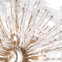 Poppy Large Chandelier with clear undulating glass discs and natural brass rods in a sputnik-style design.