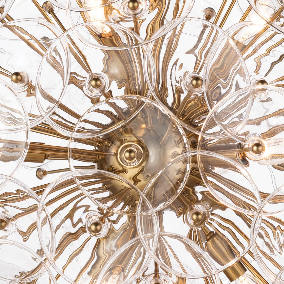 Poppy small glass & brass chandelier with clear undulating glass discs and candelabra bulbs.