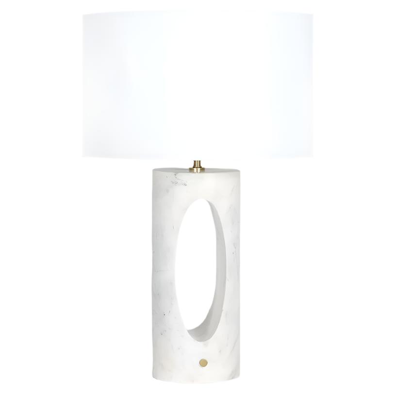 Portia Marble Table Lamp with natural white marble base, lavender veining, oval cutout, and linen shade.