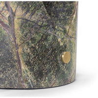 Close-up of a Portia Marble Table Lamp base, featuring green and brown veined marble with a brass knob.