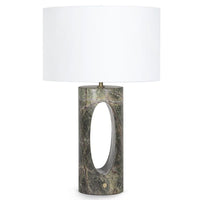Portia Marble Table Lamp with a cylindrical green marble base, oval cutout, and white linen shade.