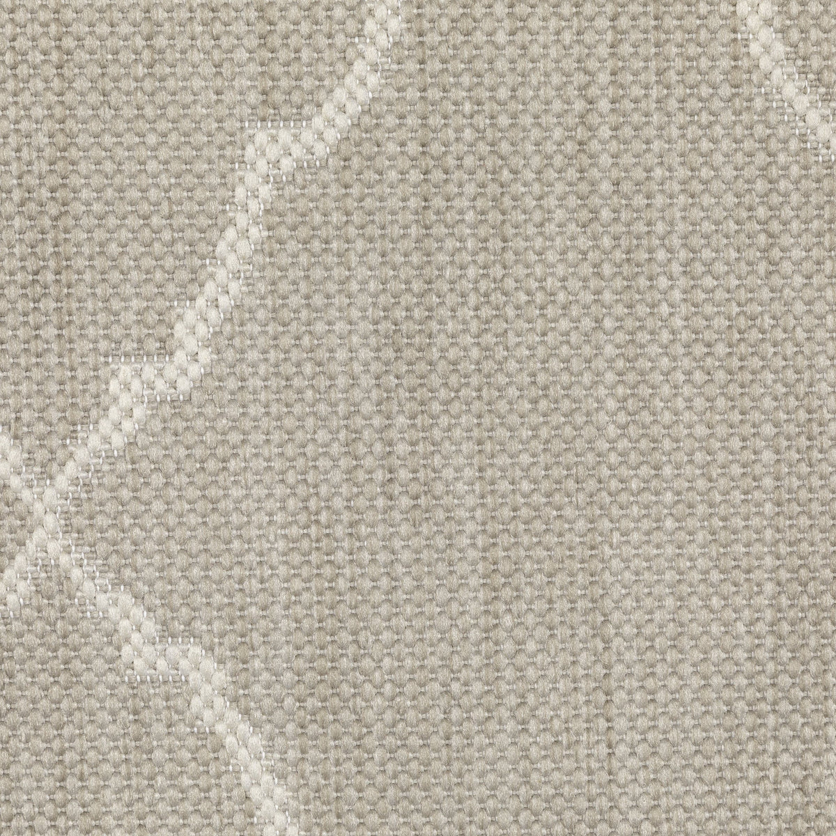 Close-up of a Portofino Grey flatwoven polypropylene outdoor rug with a subtle geometric pattern.