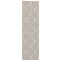 Portofino Grey flatwoven polypropylene outdoor rug with a white Moroccan trellis pattern.
