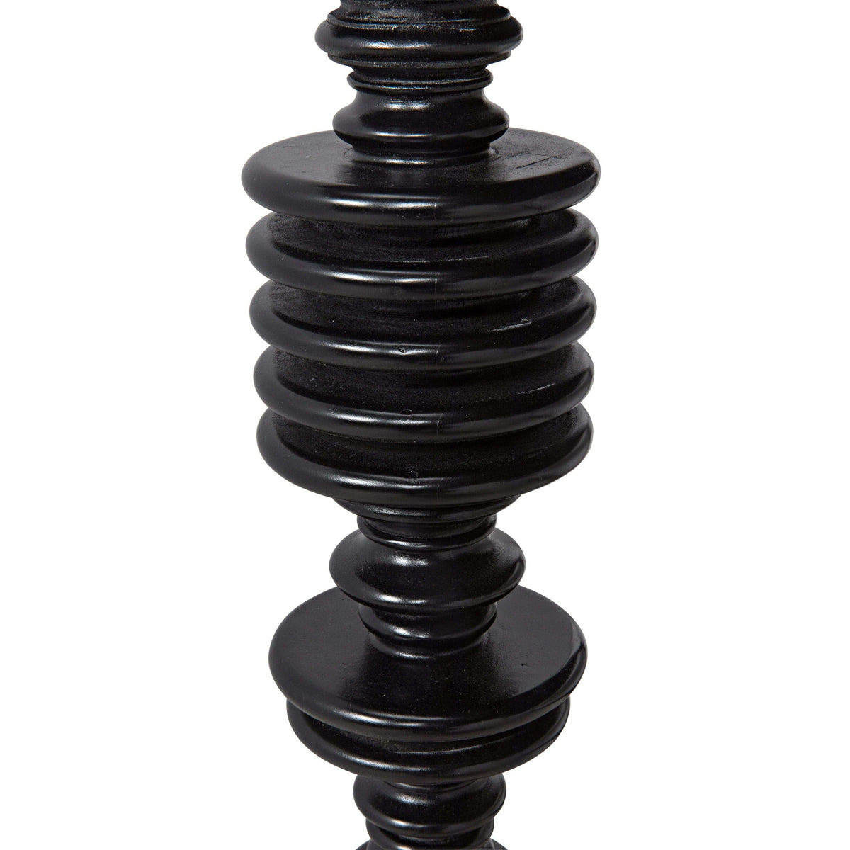 Close-up of a black hand-rubbed solid mahogany desk leg with classic spool turning craftsmanship.