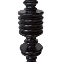 Close-up of a black hand-rubbed solid mahogany desk leg with classic spool turning craftsmanship.