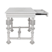 White mahogany office desk with spool-turned legs, carved apron, and an open drawer.