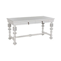 White mahogany Portuguese office desk with spool-turned legs, carved apron, and two drawers.
