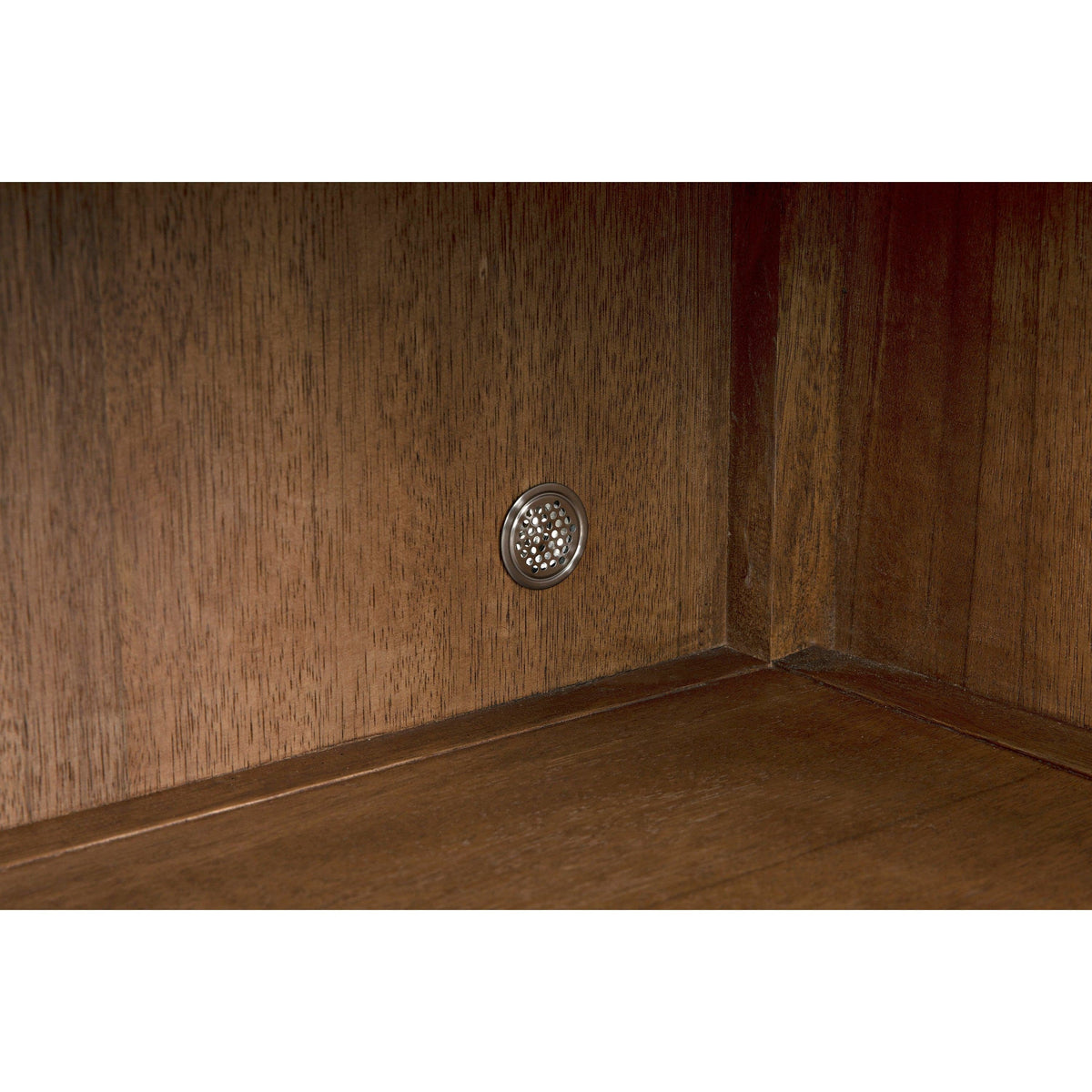 Dark walnut sideboard interior with a silver circular vent on the back panel.