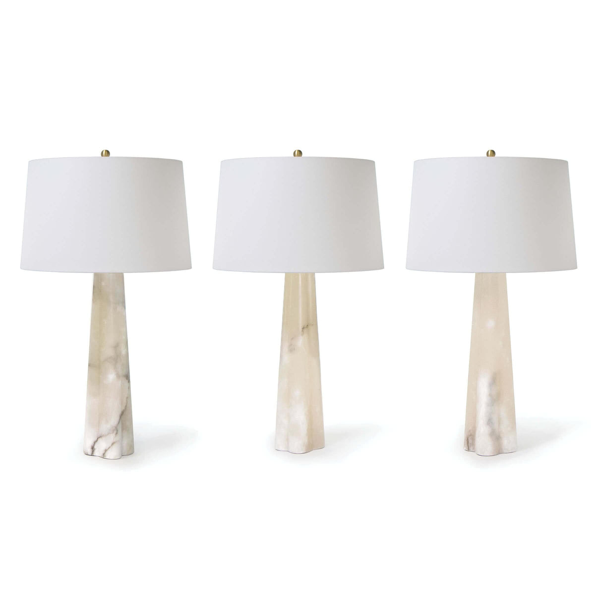 Three Quatrefoil Alabaster Table Lamps with tapered alabaster bases and white linen drum shades.