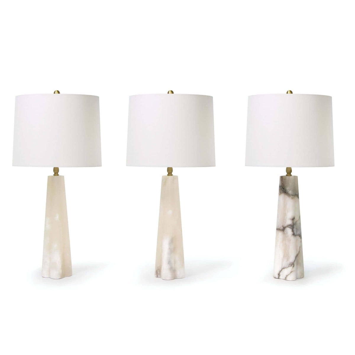 Three Quatrefoil Alabaster Table Lamps with tapered bases and white drum shades, showing varied natural stone patterns.