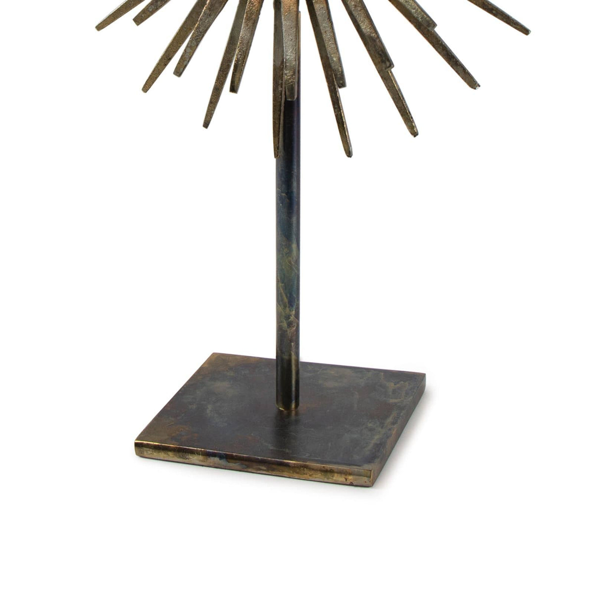 Radiant Sculpture: Industrial-chic patinated iron base with spiked mirror surround.