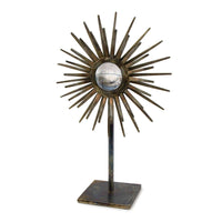 Industrial-chic Radiant Sculpture with patinated iron base, spiked surround, and convex mirror.