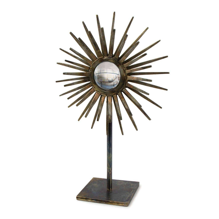 Industrial-chic Radiant Sculpture with patinated iron base, spiked surround, and convex mirror.