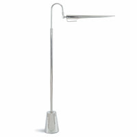 Raven floor lamp, polished nickel, with a sleek, adjustable bird-like shade and round base.