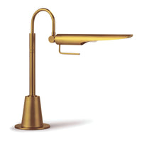 Raven Task Lamp in natural brass, featuring an adjustable, aerodynamic, bird-like shade on a slender stand.