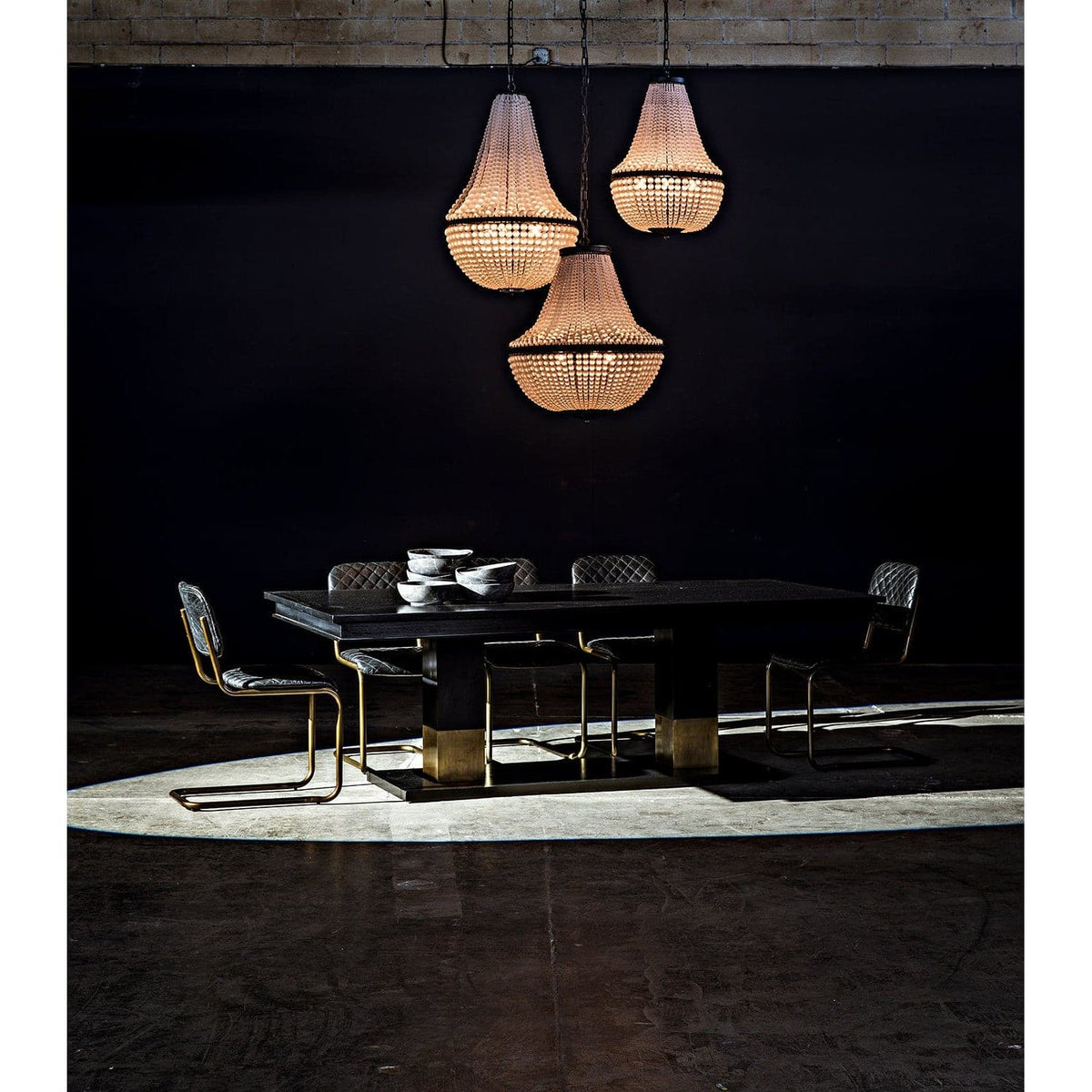 Ravenko black mahogany dining table with rectangular lines and brass leg bands.