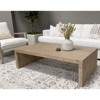 Raymond Gray Pine Coffee Table, a rustic reclaimed wood rectangular table with faux split holes.
