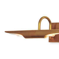 Large Redford picture light in natural brass, featuring a rotating, elongated shade with visible bulbs.