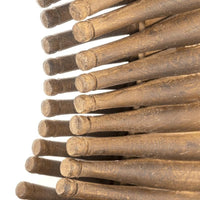 Close-up of a rustic round mirror frame made from antique-inspired mini wooden rolling pins.
