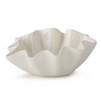 Large creamy white ceramic bowl with distinctive ruffled edges.