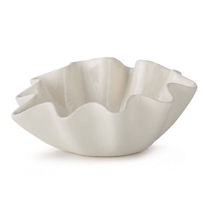Large creamy white ceramic bowl with distinctive ruffled edges.