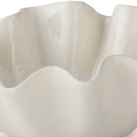Medium creamy white ceramic bowl with ruffled edges.