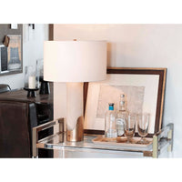Sacha Alabaster Table Lamp with white linen shade and gold leaf metal base on a bar cart.
