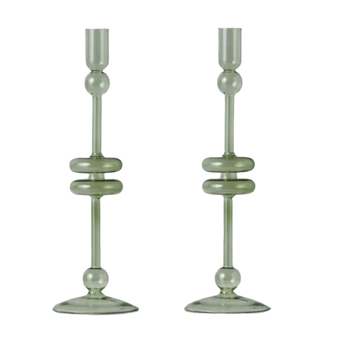 Pair of medium sage green glass candlesticks with elegant tapered design and decorative rings.