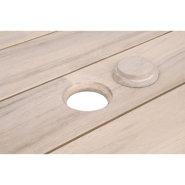 Close-up of a gray teak outdoor dining table with a round umbrella hole and matching cover.